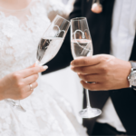 groom-with-bride-are-knocking-glasses-with-champagne-compress